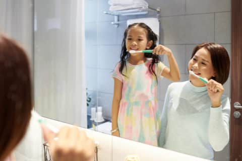 brushing with CTx Toothpaste