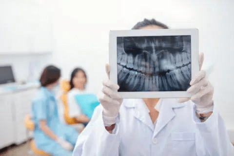 Dentist Showing Jaw X-ray | Kherani Dental